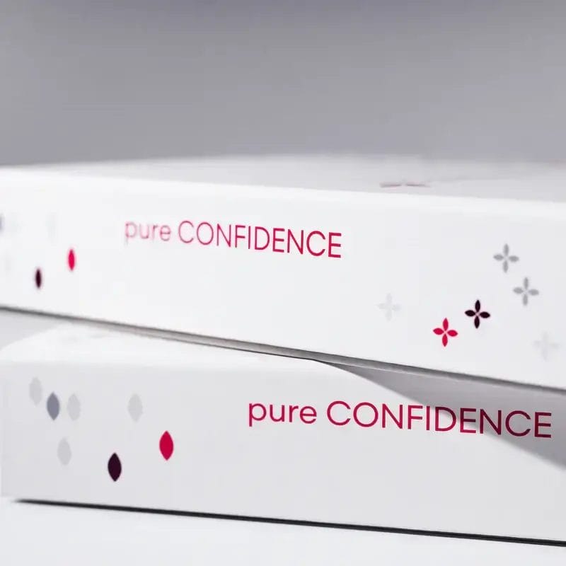 Pure Confidence product packaging for wellness and skincare solutions