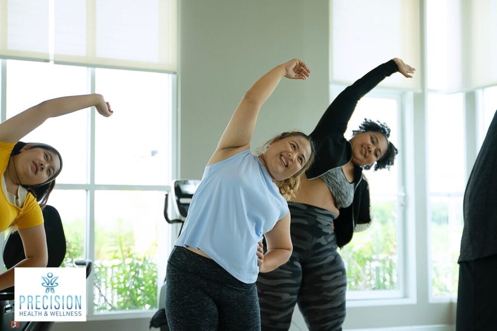 Women stretching in fitness to optimize hormone balance and wellness.